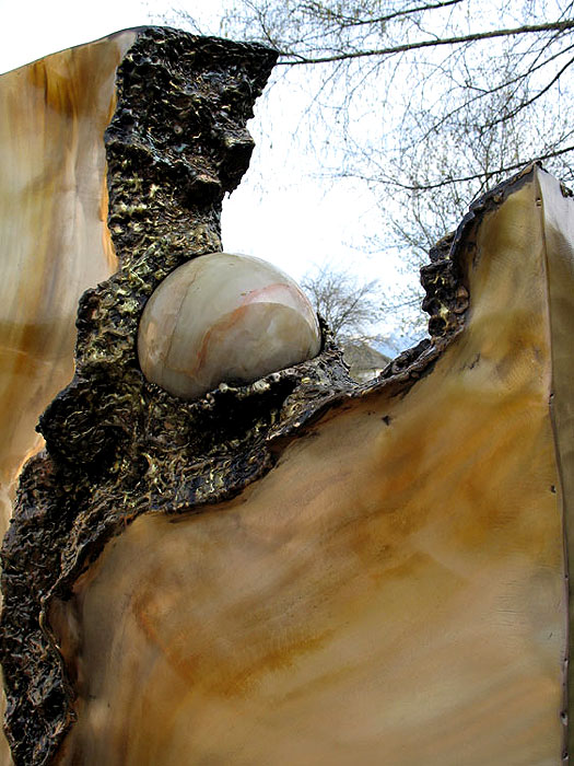 Unique Grave Sculpture, Bronze block with a crack and a marble ball inside