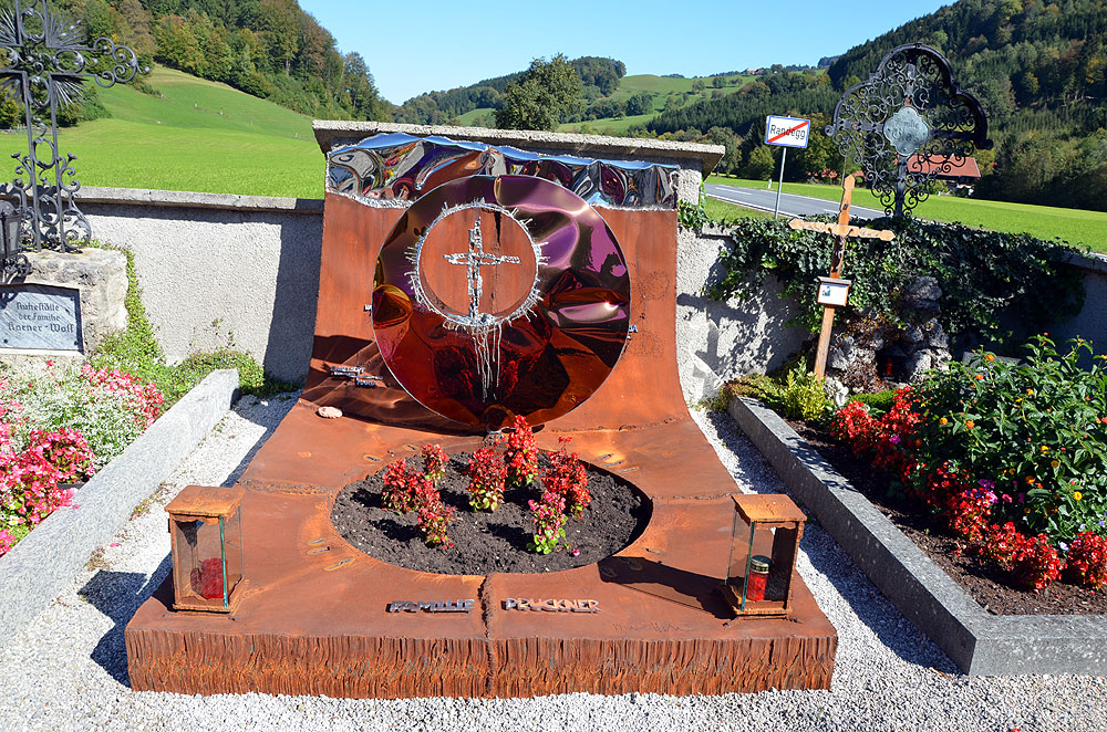 Rusted grave design and red stainless disk