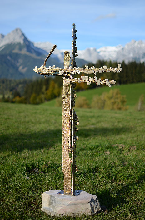 Melted bronze cross