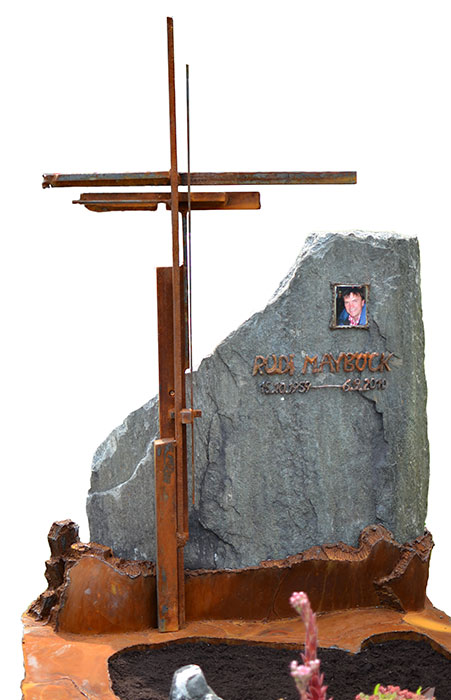 Rusted upright grave cross made of different flat-steels