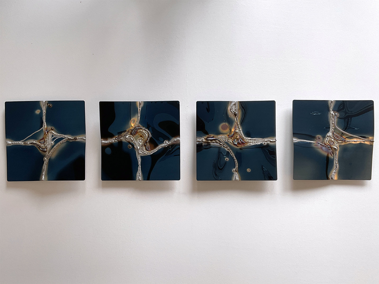 4x1 wall artwork in blue, polished stainless steel
