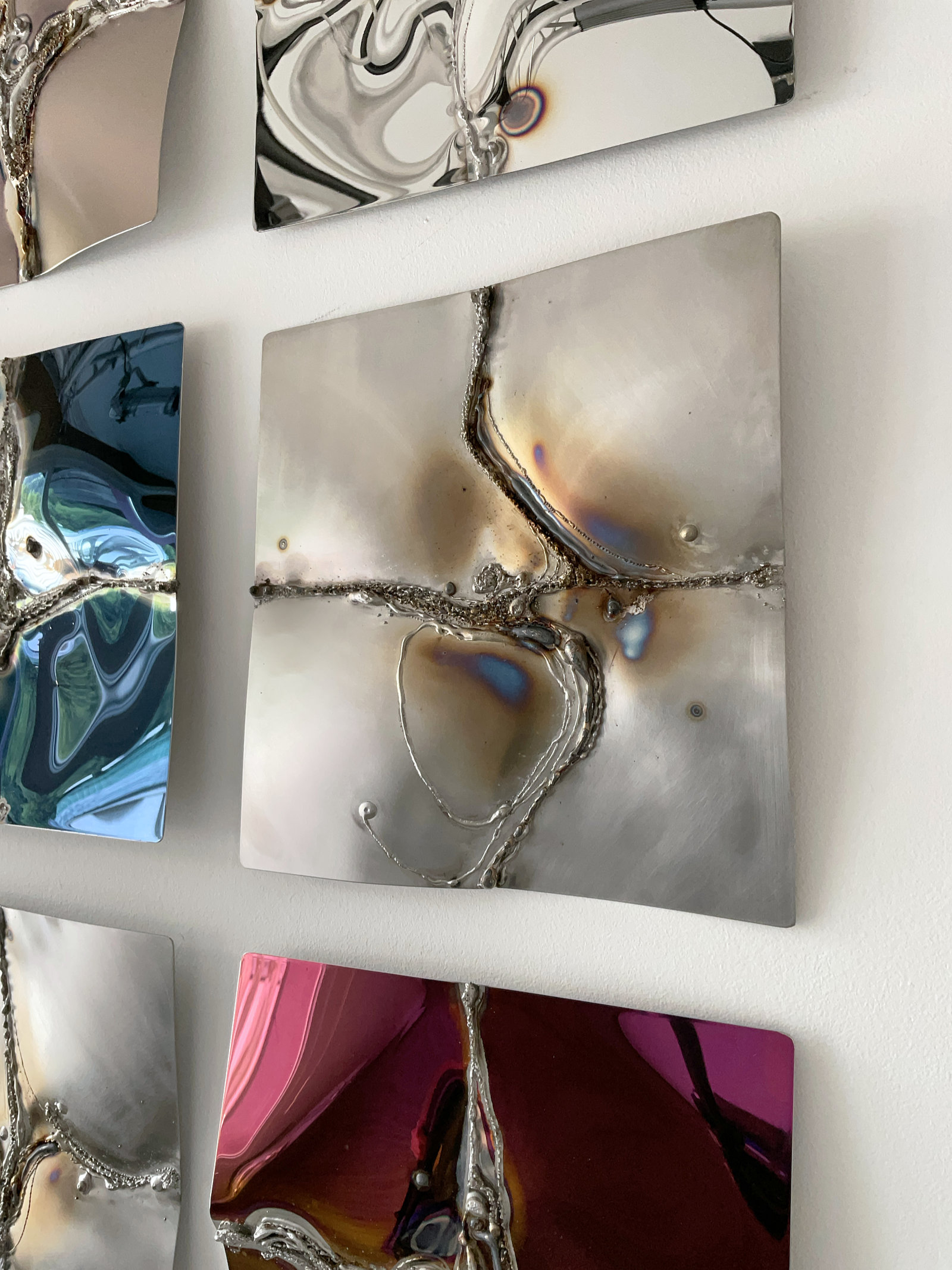 Wall artwork in ground stainless steel