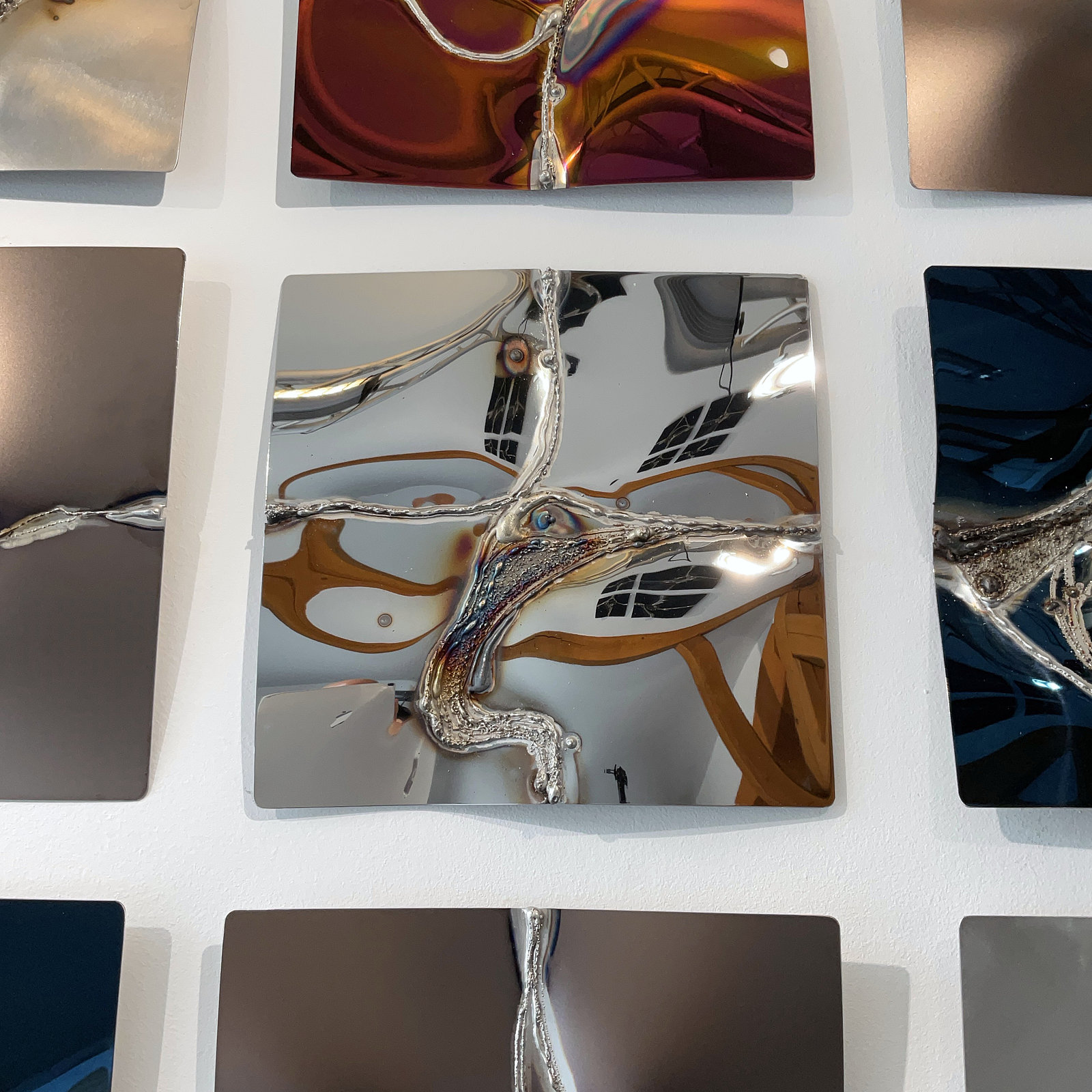 Wall artwork in colorless polished stainless steel