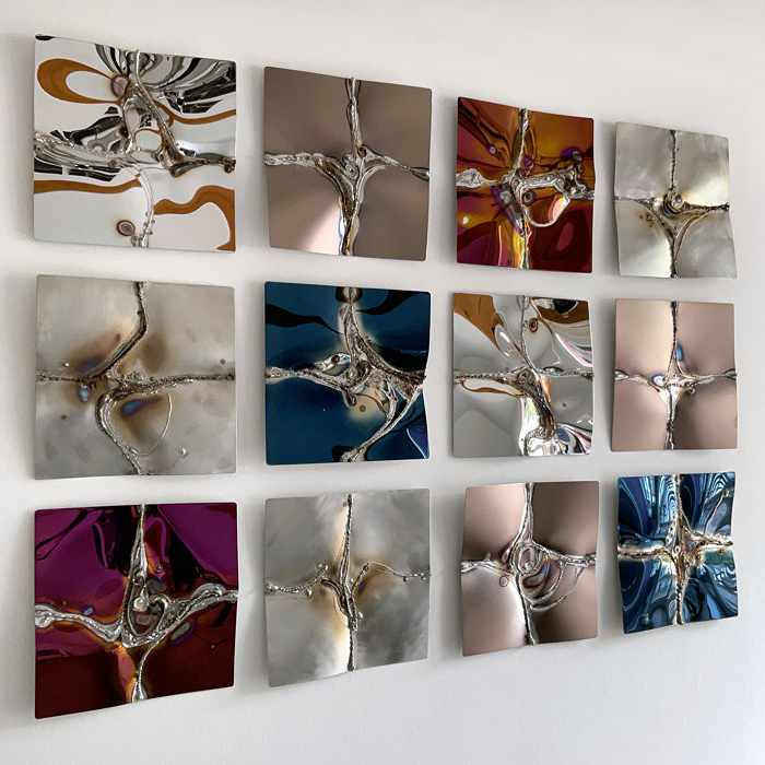 Small squares create a wall-filling work of art in stainless steel