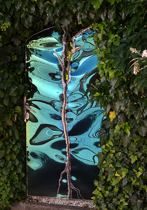 Artistic garden gate in stainless steel