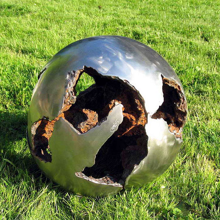 Garden-Sculpture. Outdoor sphere sculptur of stainless and rusted steel.